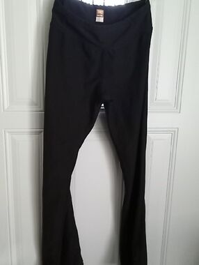 Lucy Black Activewear Top with Orange Logo Label